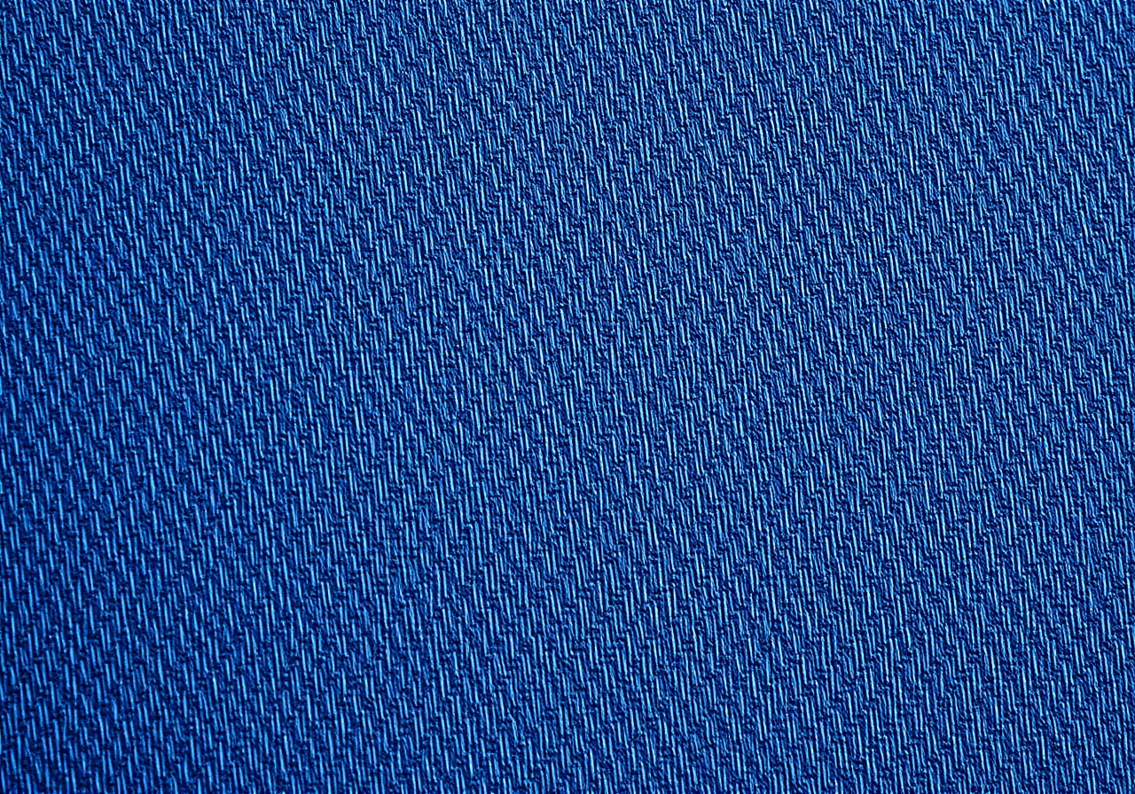 Macro detail of woven fabric texture showing thread structure and material depth